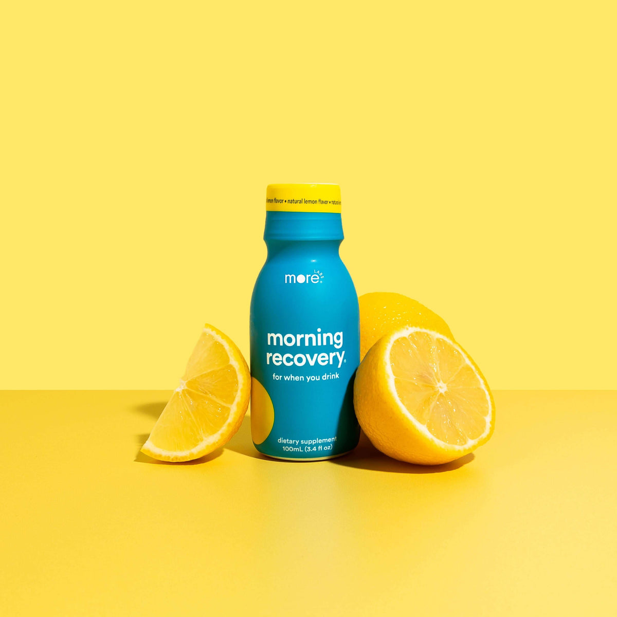 Morning Recovery herbal supplement bottle with lemon slices, perfect for recovery after drinking.